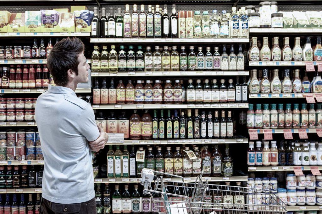 man looking at grocery isle