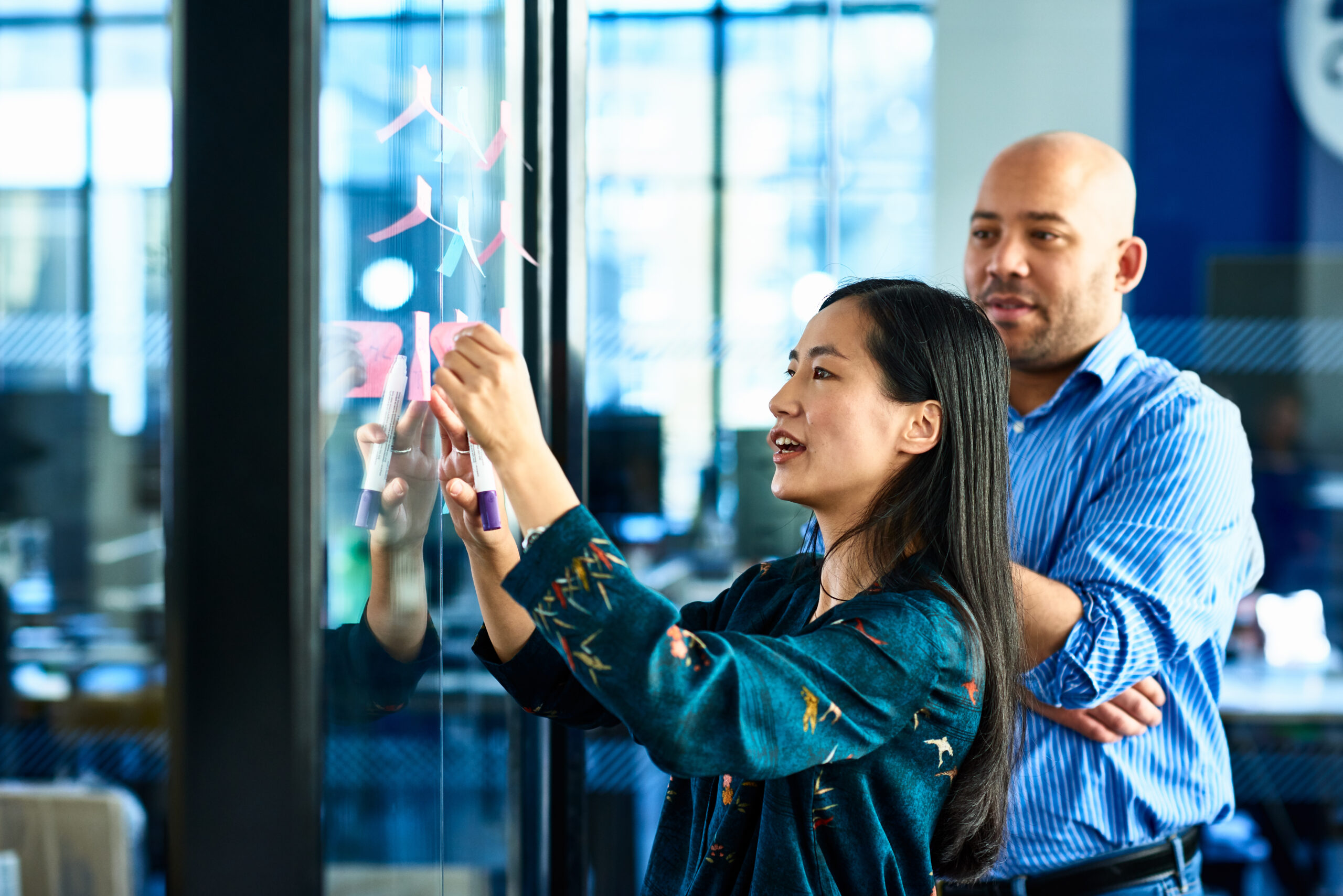 Marketers collaborating on potential solutions for a client challenge