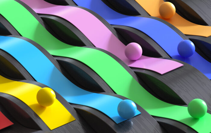 Digital generated image of abstract multicolored curved ribbons with spheres rolling on them on digital black wavy surface.