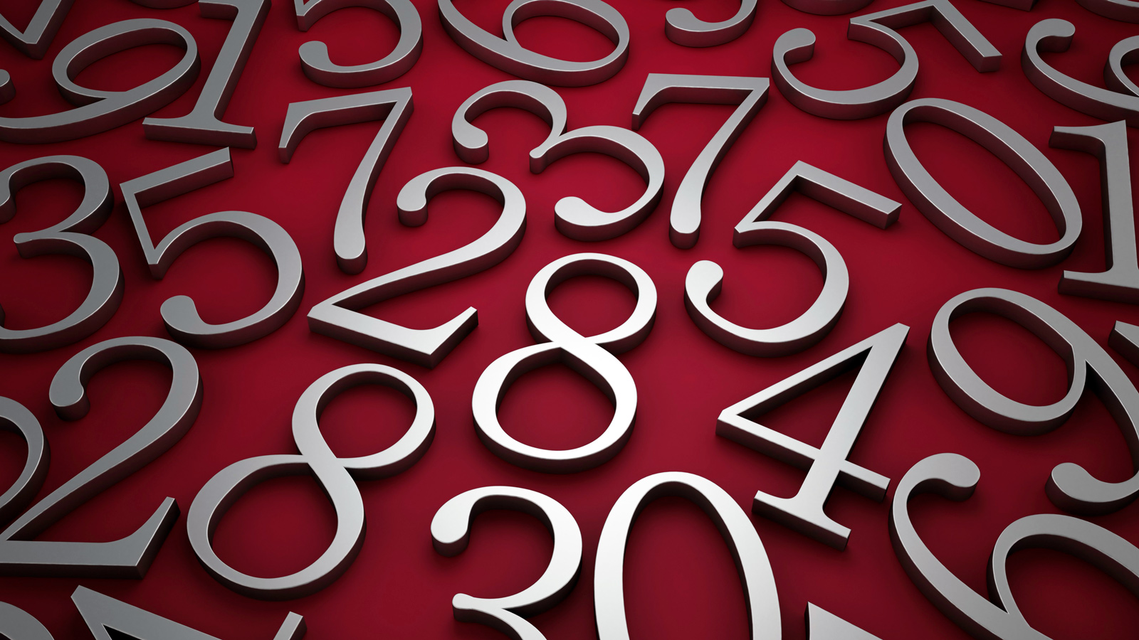 Silver metallic numbers laid on red surface