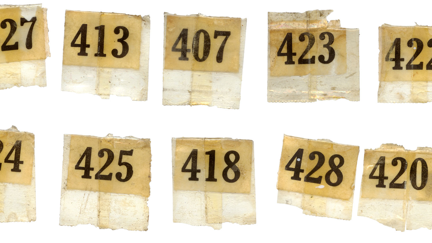 A collected of vintage number labels that came off an antique printers tray