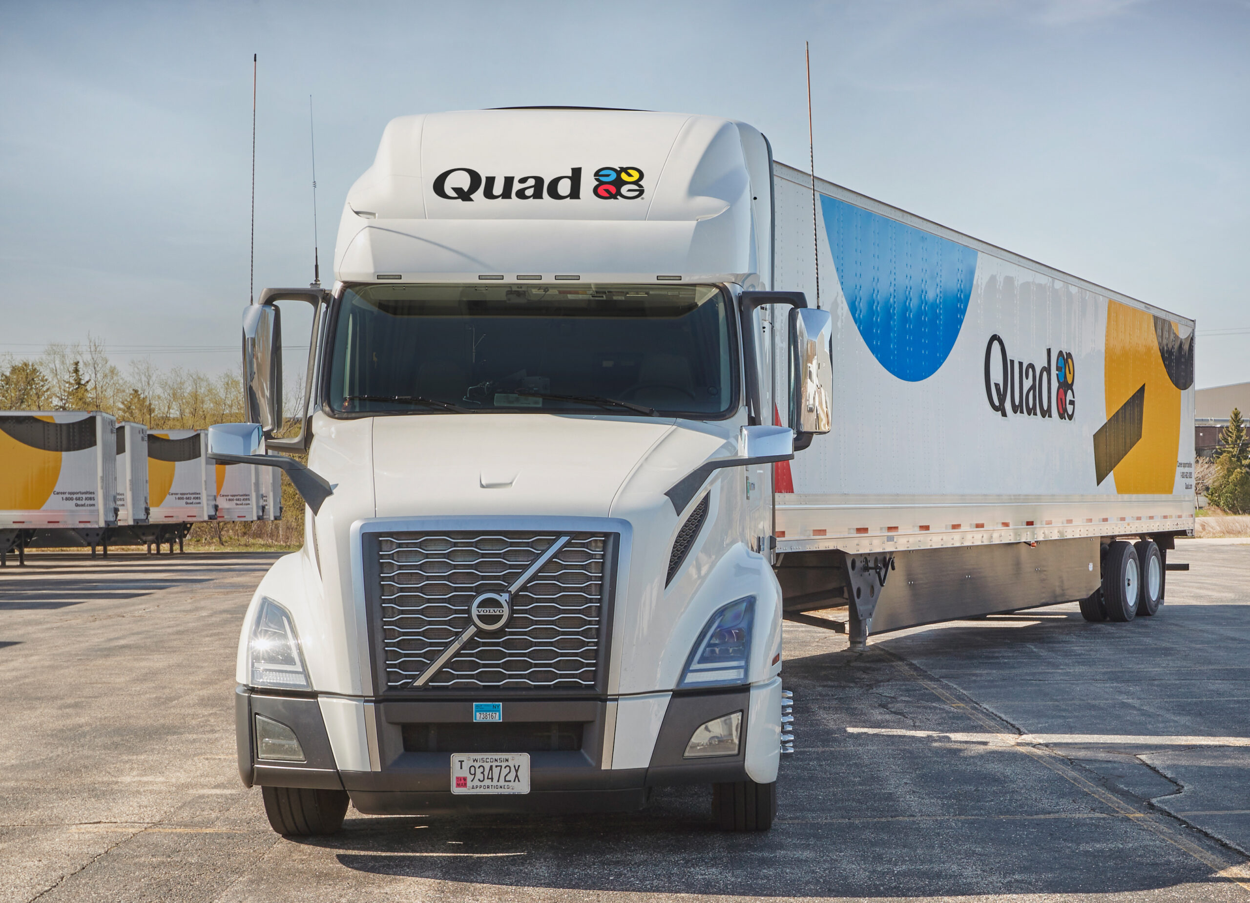 A truck using Quad’s supply chain and partnerships for streamlined logistics and budget saving