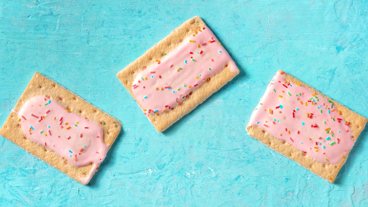 Pop tarts flat lay panorama on a blue background