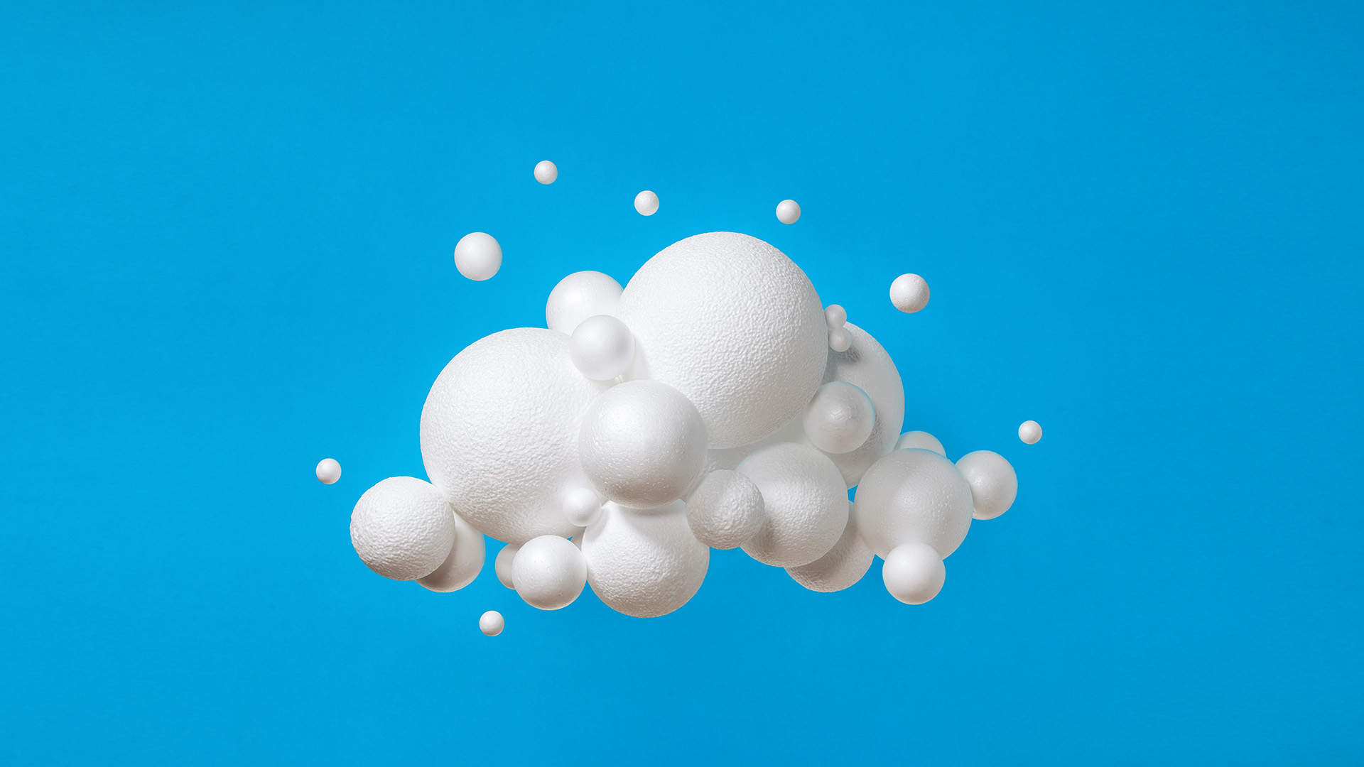 Abstract cloud made of spheres on blue background