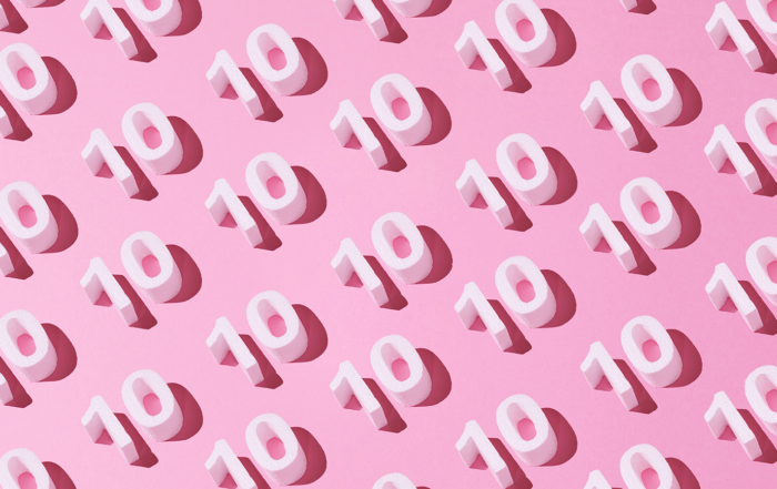 Repeating pattern of the number 10 on a pink background