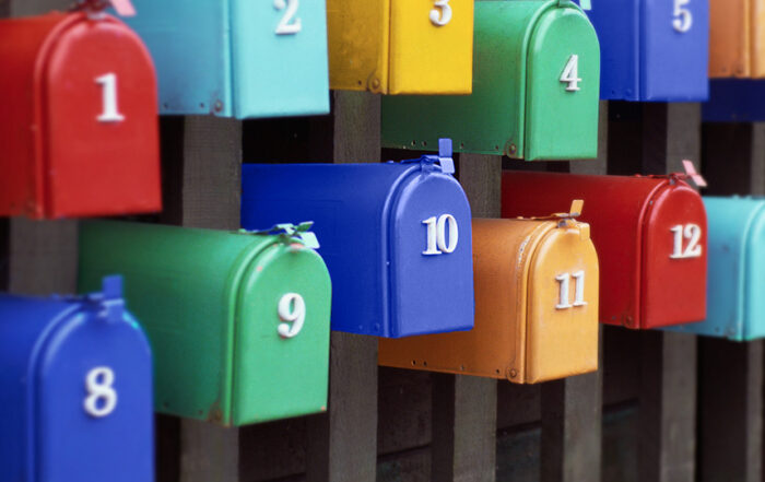 Colorful group of colorful mailboxes with numbers 1 through 13