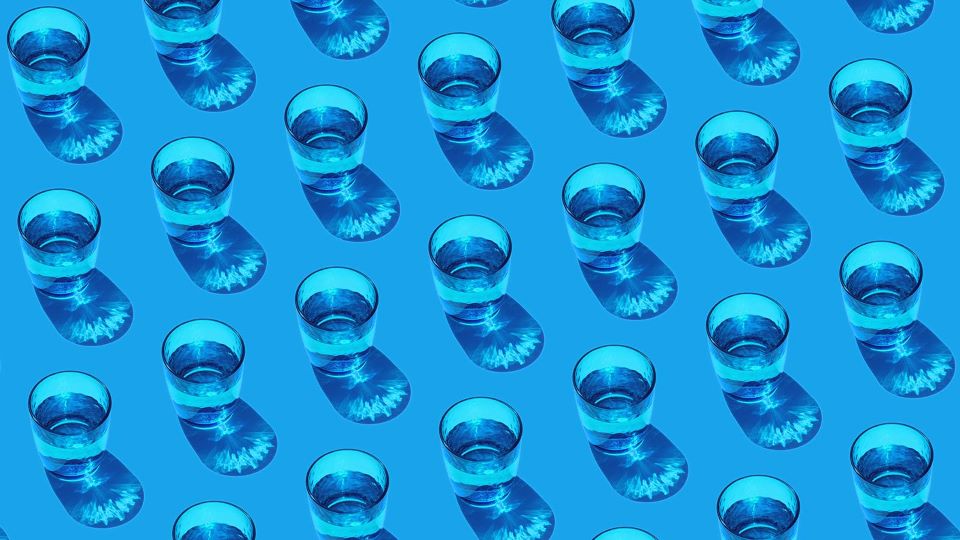 Repeating pattern of water glasses half filled