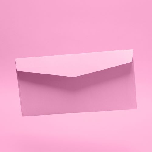 A pink postal envelope on a pink background