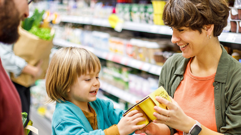 Family in a store shopping for groceries