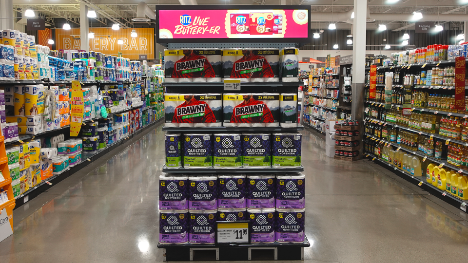 In-Store Connect by Quad end-cap display In-store digital retail media screen advertises CPG brands to shoppers in a regional grocery store