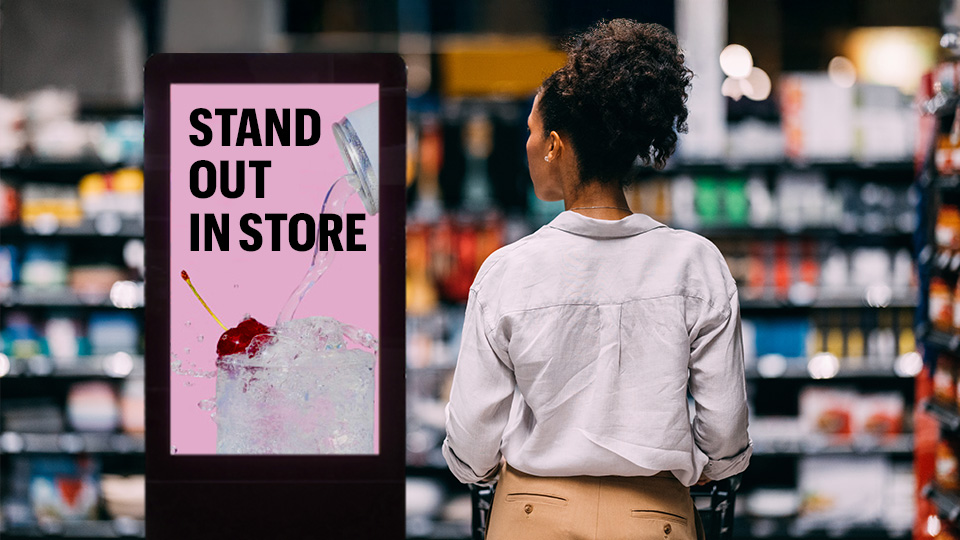 In-store advertising campaign driving consumer engagement. Text reads: Stand out in-store