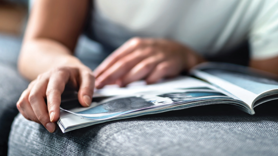 Consumer browsing a holiday shopping catalog