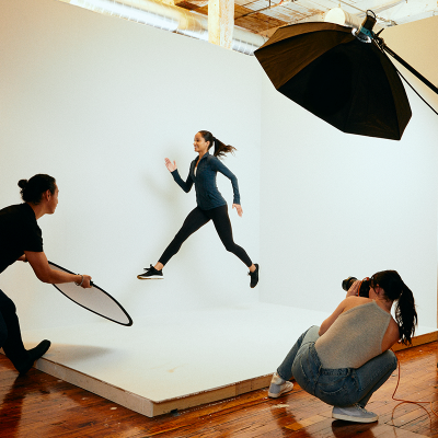 A photoshoot of a person leaping into the air