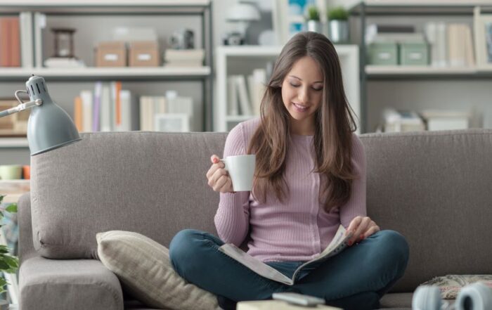 Consumer at home reading a holiday shopping catalog