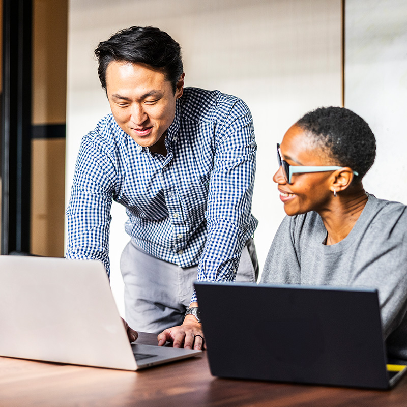 A marketing professional working with their client to navigate industry shifts A marketing professional working with their client to navigate industry shifts