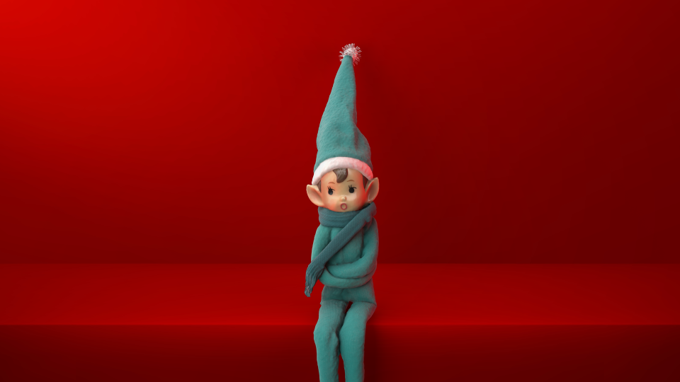 A holiday elf sitting on a shelf