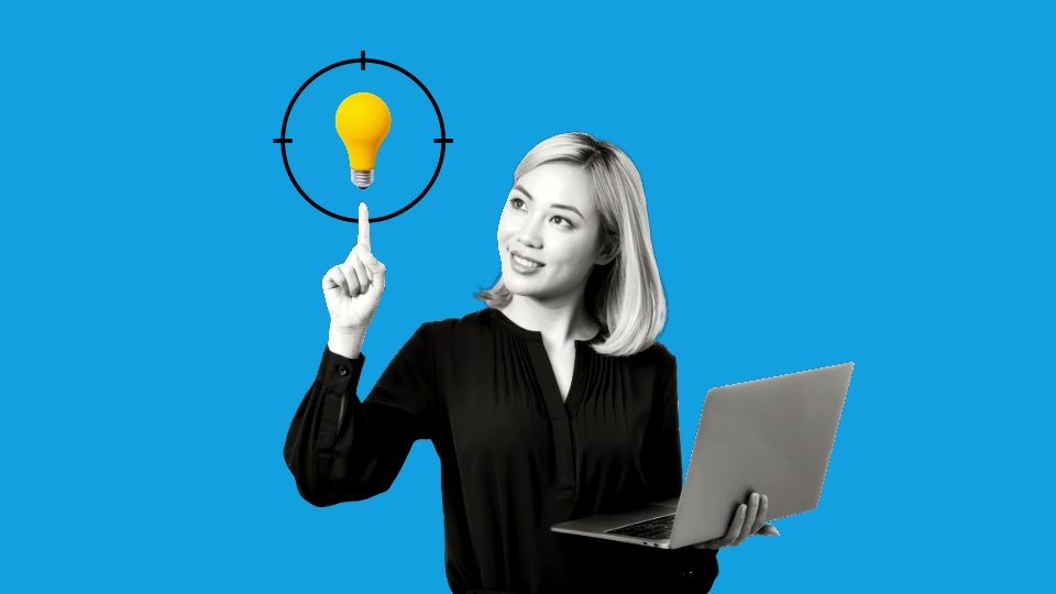 A woman holding their laptop in their left hand, while pointing up at a yellow lightbulb in front of a blue background