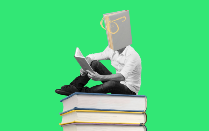 A book reading a book while sitting on top of a stack of books in front of a green background.