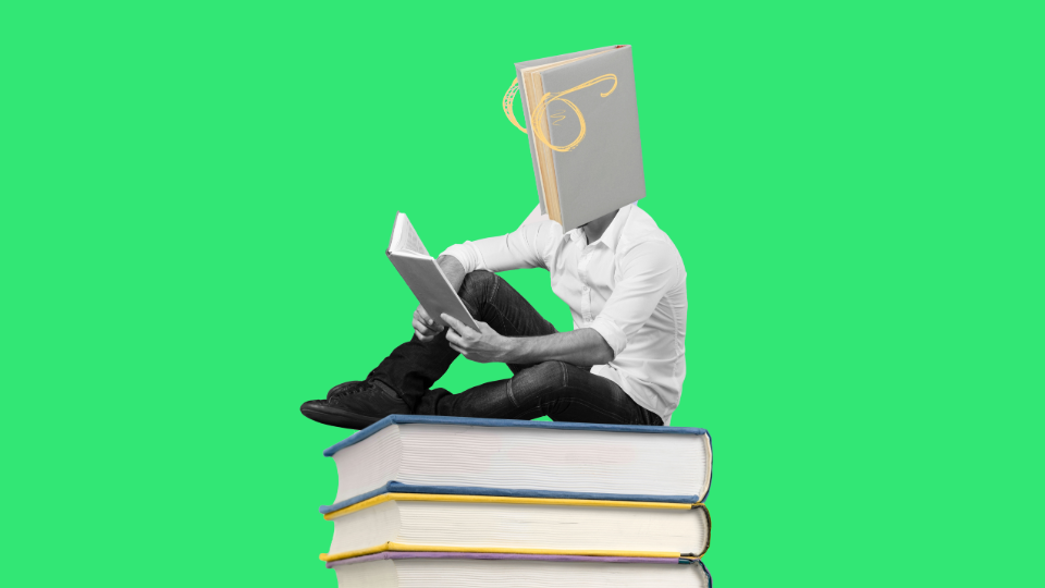 A book reading a book while sitting on top of a stack of books in front of a green background.
