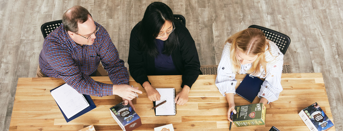 Packaging team collaborating with clients on testing possibilities Packaging team collaborating with clients on testing possibilities