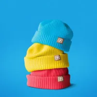 Company branded winter caps on a blue background