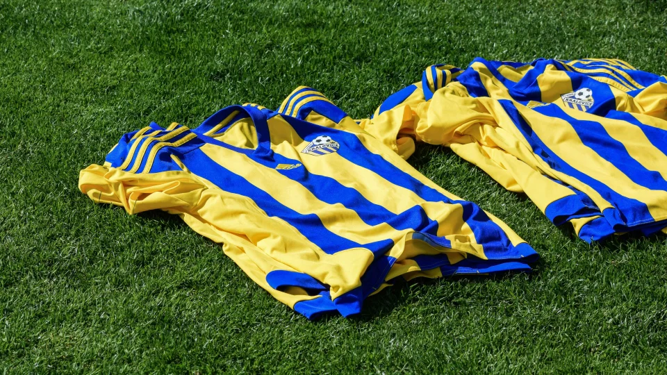 Soccer jerseys laying on the turf