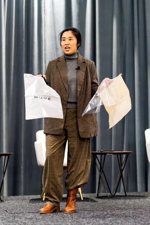 Mengmeng Zhao showcasing different packaging options for sustainability